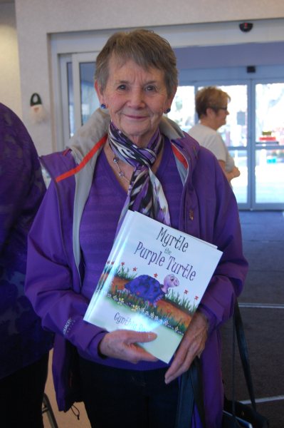 Blog Photo - BoAA Book signing - Purple lady with books
