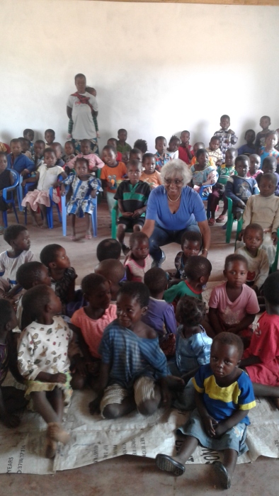 Blog Photo - Kamala-Jean kneels with kids